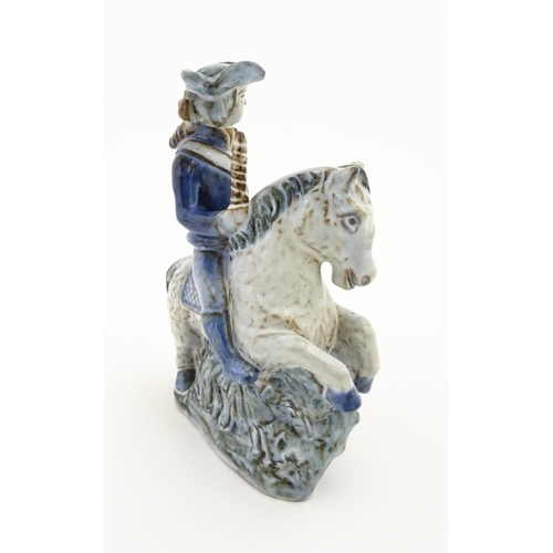 130 - A Danish pottery model of a figure on horseback by L. Hjorth. Marked under L. Hjorth Denmark. Approx... 