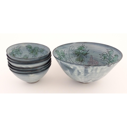 141 - Seven studio pottery bowls by Tessa Fuchs (1936-2012) decorated with fruiting vines. Marked TF under... 
