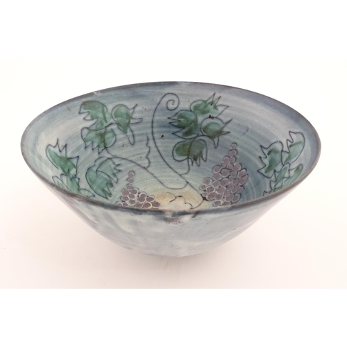 141 - Seven studio pottery bowls by Tessa Fuchs (1936-2012) decorated with fruiting vines. Marked TF under... 