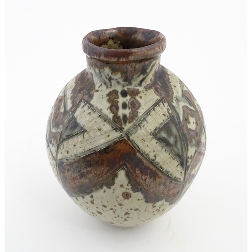 142 - A South African Rorke's Drift studio pottery vase with geometric decoration. In the manner of Dinah ... 