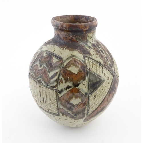 142 - A South African Rorke's Drift studio pottery vase with geometric decoration. In the manner of Dinah ... 