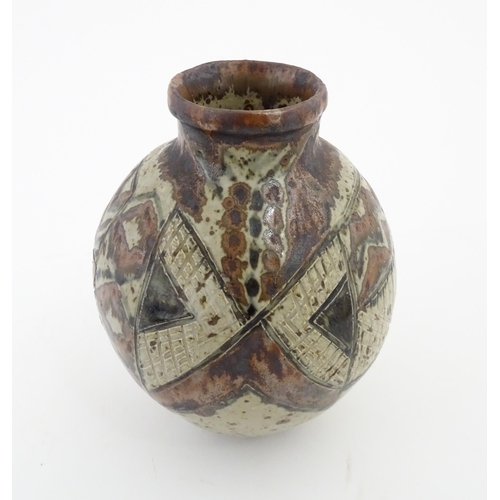 142 - A South African Rorke's Drift studio pottery vase with geometric decoration. In the manner of Dinah ... 