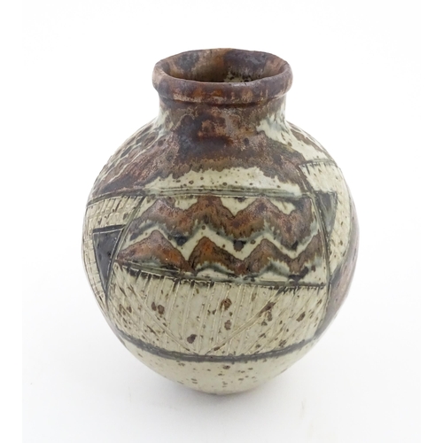 142 - A South African Rorke's Drift studio pottery vase with geometric decoration. In the manner of Dinah ... 