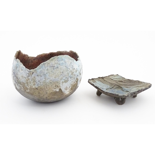 149 - Two items of studio pottery to include a raku bowl with pinched rim, and a footed dish of squared fo... 