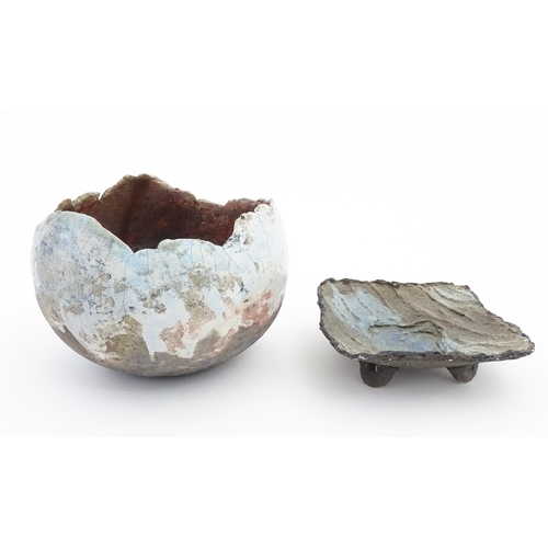 149 - Two items of studio pottery to include a raku bowl with pinched rim, and a footed dish of squared fo... 