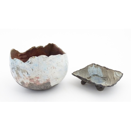 149 - Two items of studio pottery to include a raku bowl with pinched rim, and a footed dish of squared fo... 