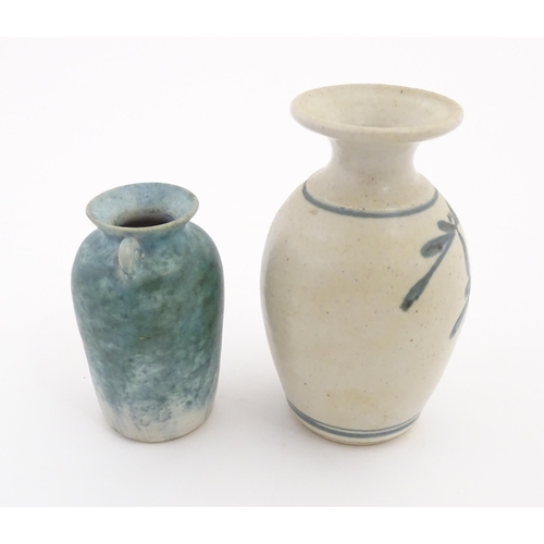152 - Two items of studio pottery comprising a small vase with twin scroll handles and blue glaze by Paul ... 