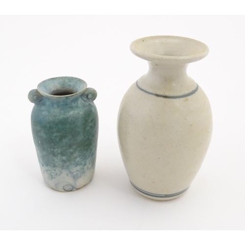 152 - Two items of studio pottery comprising a small vase with twin scroll handles and blue glaze by Paul ... 