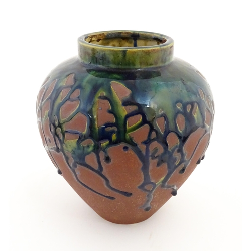153 - A studio pottery vase of baluster form with drip glaze. Approx. 9
