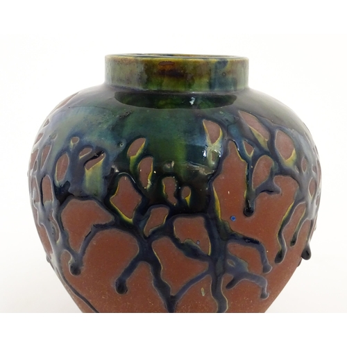 153 - A studio pottery vase of baluster form with drip glaze. Approx. 9
