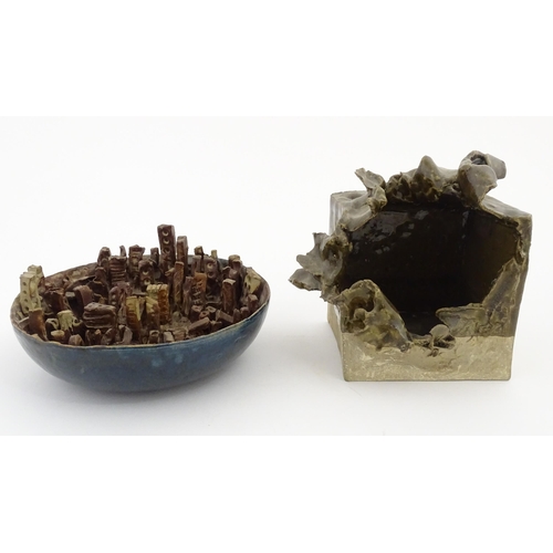 156 - Two items of studio pottery by C. Webster comprising a planter of squared form with abstract detail,... 