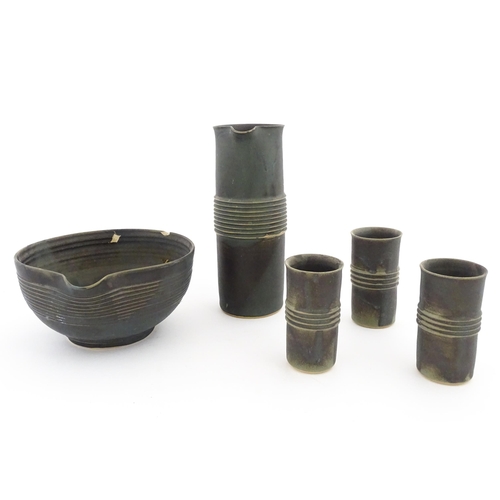158 - Five studio pottery items by Deborah Hopson Wolpe, comprising ewer, bowl, and three beakers each wit... 
