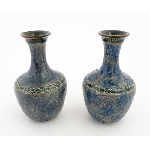 163 - A pair of Doulton Lambeth vases with floral and foliate decoration. Impressed under with Doulton Lam... 