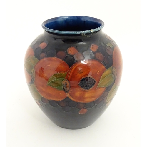 165A - A Moorcroft vase of baluster form decorated in the Pomegranate pattern. Marked under. Approx. 6