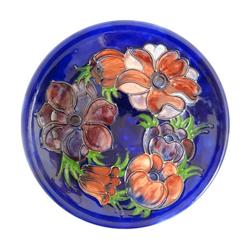 166A - Two Moorcroft plates decorated in the Clematis pattern. Marked under. Approx. 10 1/4