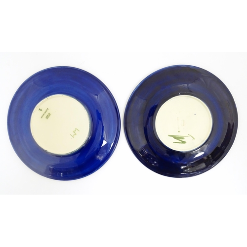 166A - Two Moorcroft plates decorated in the Clematis pattern. Marked under. Approx. 10 1/4