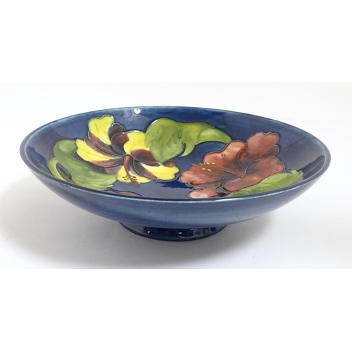167A - A Moorcroft bowl decorated in the Hibiscus patter. Together with two Moorcroft ashtrays. Bowl approx... 