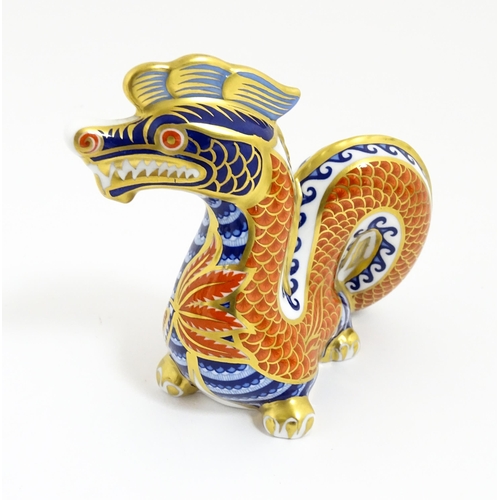 170 - A Royal Crown Derby paperweight modelled as a dragon. With gold stopper. Approx. 4 1/2