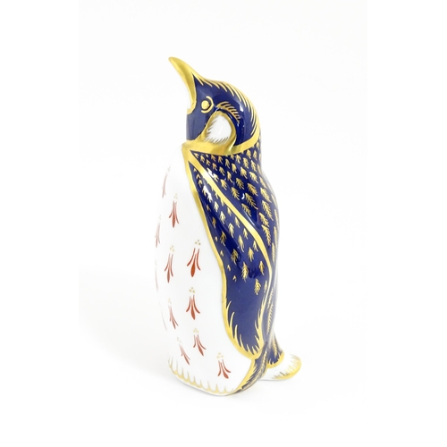 174 - A Royal Crown Derby paperweight modelled as a penguin. With gold stopper. Approx. 5 1/4