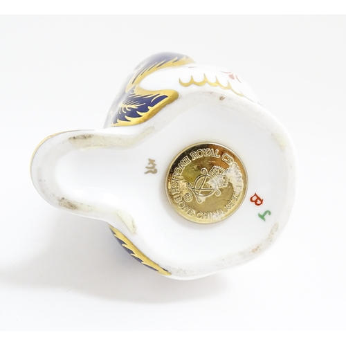 174 - A Royal Crown Derby paperweight modelled as a penguin. With gold stopper. Approx. 5 1/4