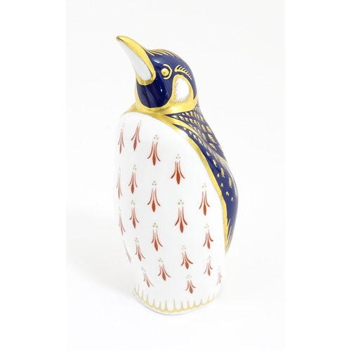 174 - A Royal Crown Derby paperweight modelled as a penguin. With gold stopper. Approx. 5 1/4