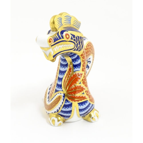 175 - A Royal Crown Derby paperweight modelled as a dragon. With gold stopper. Approx. 4 1/2