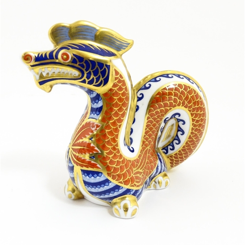 175 - A Royal Crown Derby paperweight modelled as a dragon. With gold stopper. Approx. 4 1/2