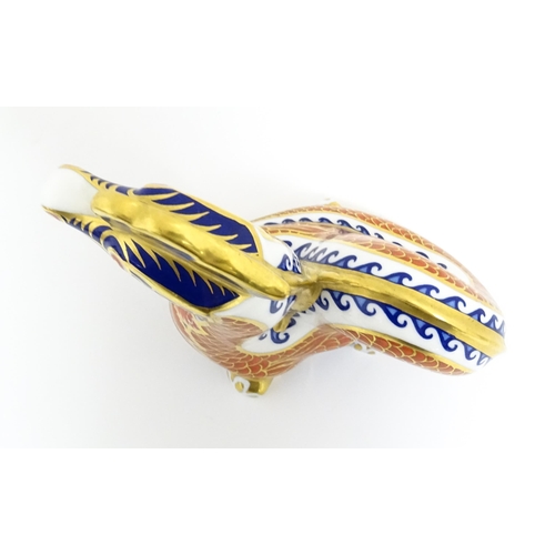 175 - A Royal Crown Derby paperweight modelled as a dragon. With gold stopper. Approx. 4 1/2