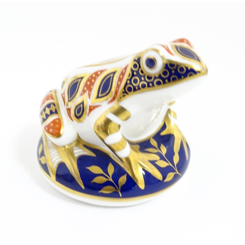 176 - A Royal Crown Derby paperweight modelled as a frog. With gold stopper. Approx. 3