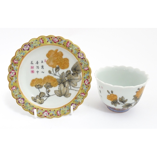 18 - A Chinese dish with scalloped edge decorated with flowers, foliage and Character script, with a flor... 