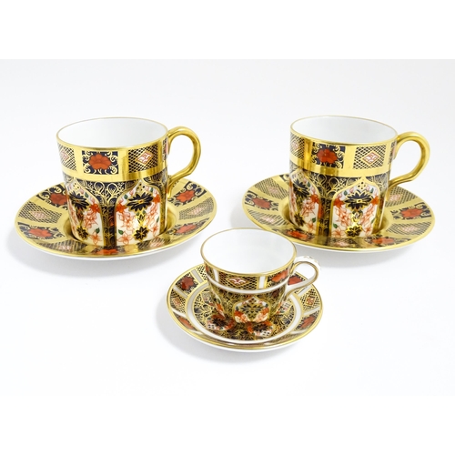 183 - A quantity of Royal Crown Derby wares decorated in the Imari pattern to include cups, saucers, plate... 