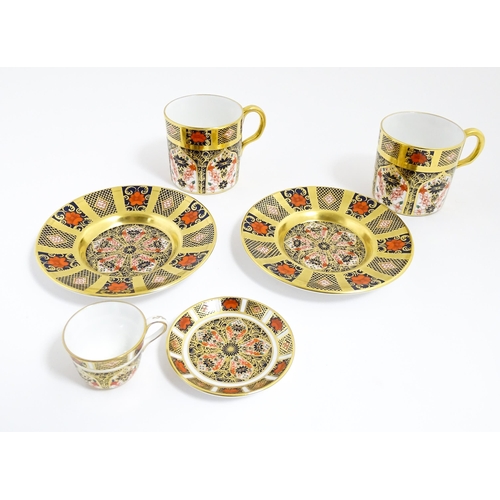 183 - A quantity of Royal Crown Derby wares decorated in the Imari pattern to include cups, saucers, plate... 