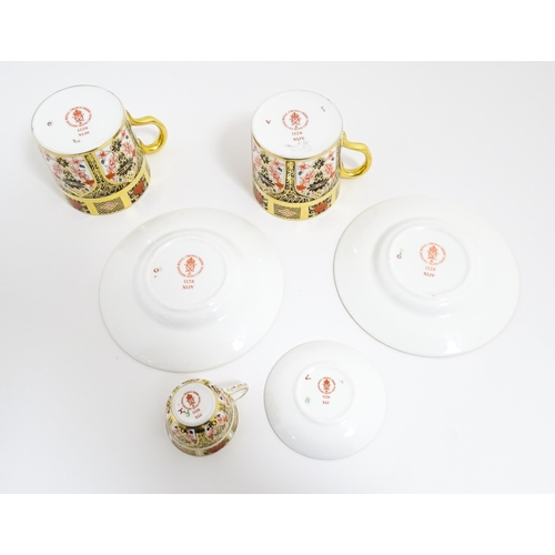 183 - A quantity of Royal Crown Derby wares decorated in the Imari pattern to include cups, saucers, plate... 