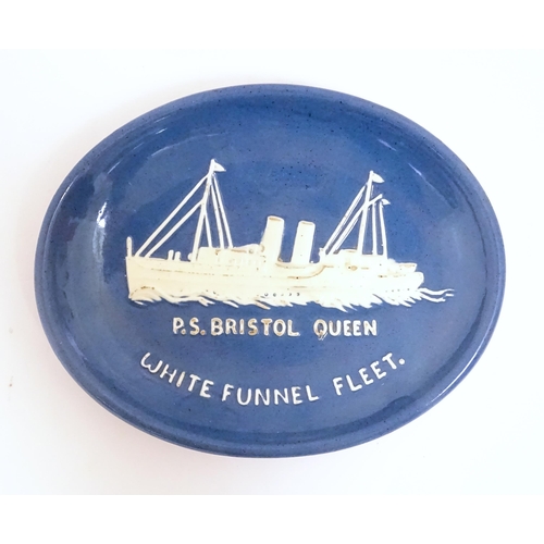 208 - A Torquay pottery dish of oval form with white slip detail depicting the Bristol Queen paddle steame... 