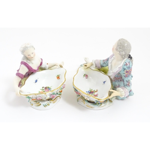 212 - A pair of Meissen style sweetmeat dish with figural detail. Crossed sword style mark under. Approx. ... 