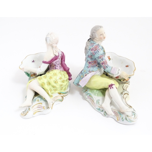 212 - A pair of Meissen style sweetmeat dish with figural detail. Crossed sword style mark under. Approx. ... 