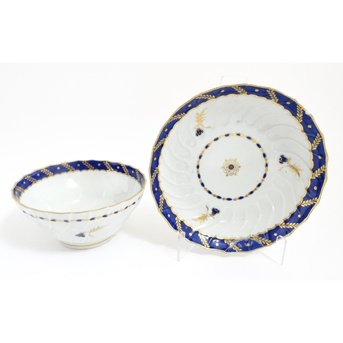 223 - A Derby tea bowl and saucer with gilt detail. Marked under. Together with a twin handled lidded suga... 