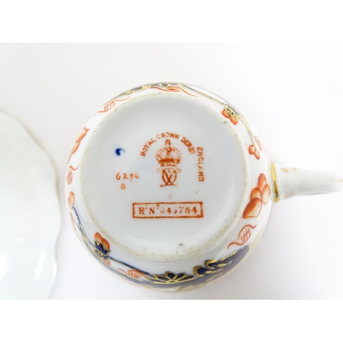 235 - A quantity of Royal Crown Derby tea wares decorated in the Imari palette to include cake plate, cups... 