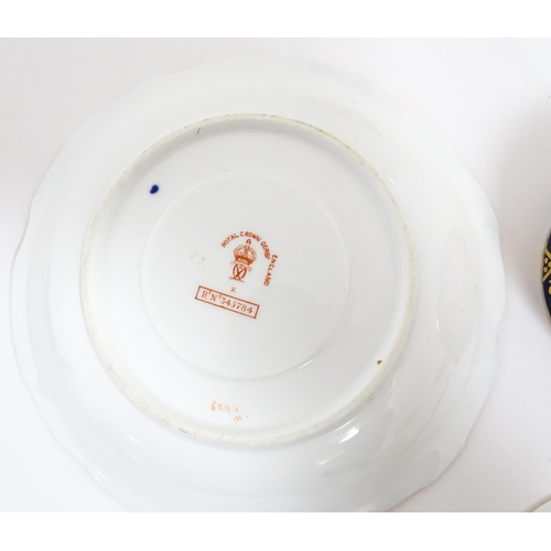 235 - A quantity of Royal Crown Derby tea wares decorated in the Imari palette to include cake plate, cups... 