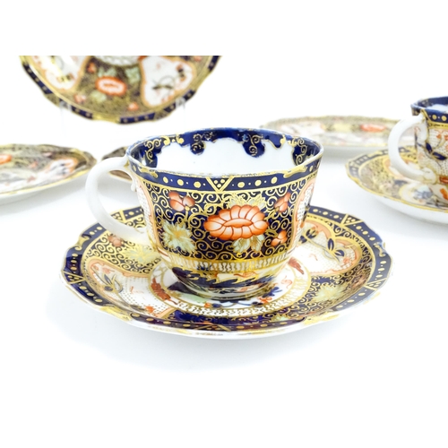 235 - A quantity of Royal Crown Derby tea wares decorated in the Imari palette to include cake plate, cups... 