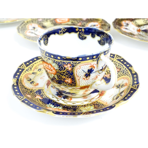 235 - A quantity of Royal Crown Derby tea wares decorated in the Imari palette to include cake plate, cups... 