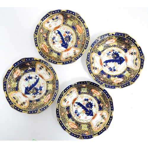 235 - A quantity of Royal Crown Derby tea wares decorated in the Imari palette to include cake plate, cups... 