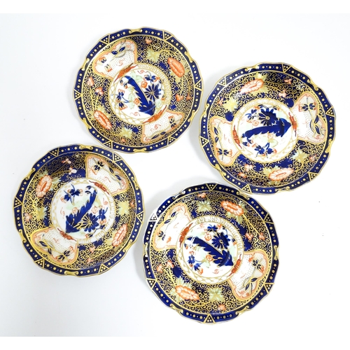 235 - A quantity of Royal Crown Derby tea wares decorated in the Imari palette to include cake plate, cups... 