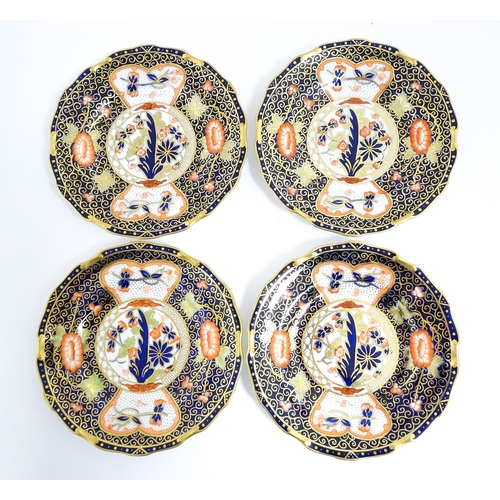 235 - A quantity of Royal Crown Derby tea wares decorated in the Imari palette to include cake plate, cups... 