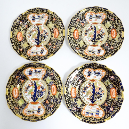 235 - A quantity of Royal Crown Derby tea wares decorated in the Imari palette to include cake plate, cups... 