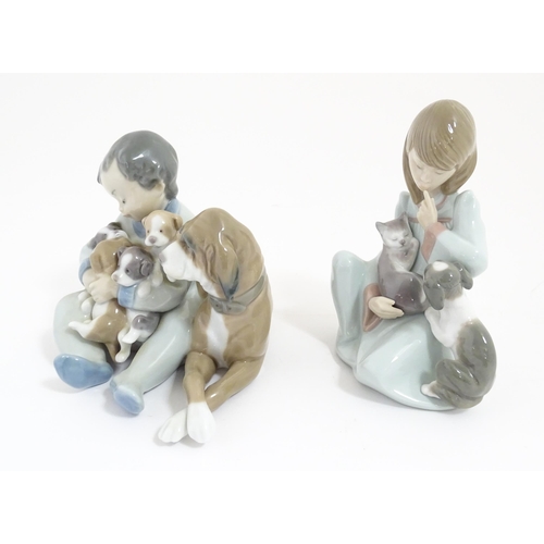 242 - Two Lladro figures comprising New Playmates, model no. 5456, and Cat Nap no. 5640. Cat Nap approx. 5... 