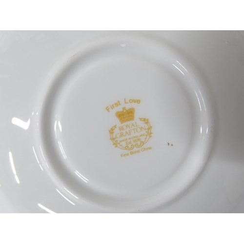 252 - A quantity of Royal Grafton dinner wares in the First Love pattern with gilt rims, to include plates... 