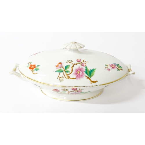 255 - A soup tureen and stand with floral and foliate decoration with gilt highlights. Together with two m... 