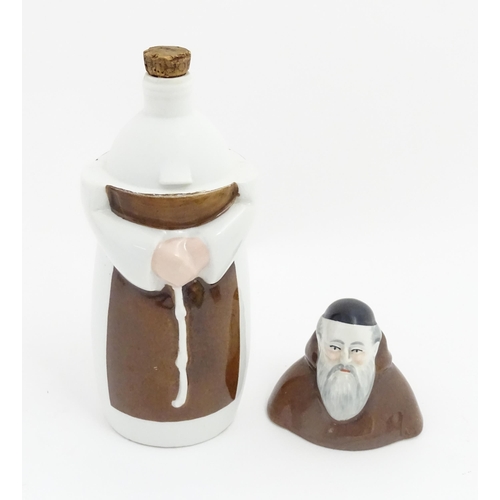 259A - A French porcelain liquor bottle / decanter modelled as a monk. Marked under France Charles Ahrenfel... 