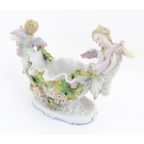 260 - A German porcelain centrepiece dish with cherub / putti and cornucopia detail. Marked under. Approx.... 